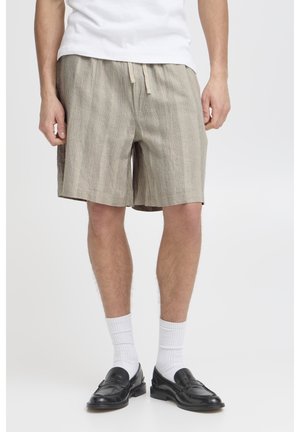 Beige, striped shorts with an elastic waistband and drawstring. Made from lightweight fabric, featuring a loose fit and mid-thigh length.