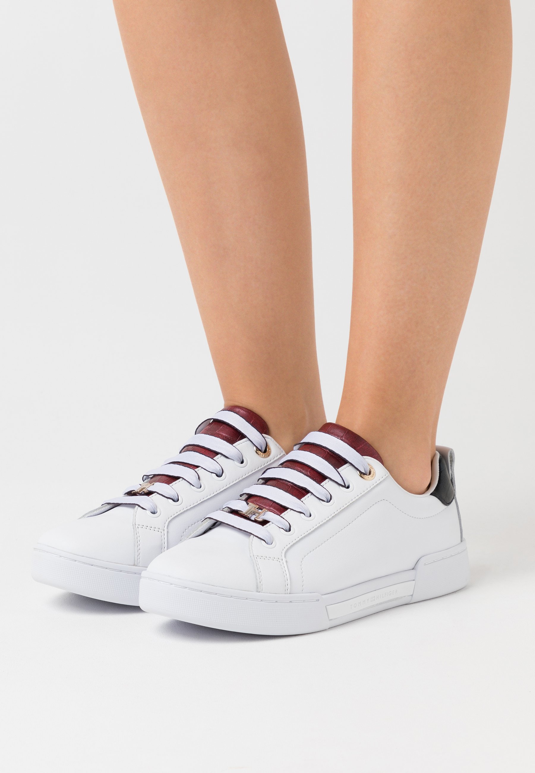 white branded trainers