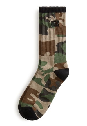 Enkele midkuit sok met een camouflagepatroon in groen, bruin, beige en zwart en een zwart Vans-logo vlak bij de bovenste boord.