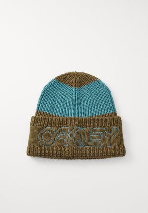 Knit beanie featuring a teal top and brown bottom. Large “OAKLEY” logo in blue stitching on the cuff. Textured fabric, snug fit.