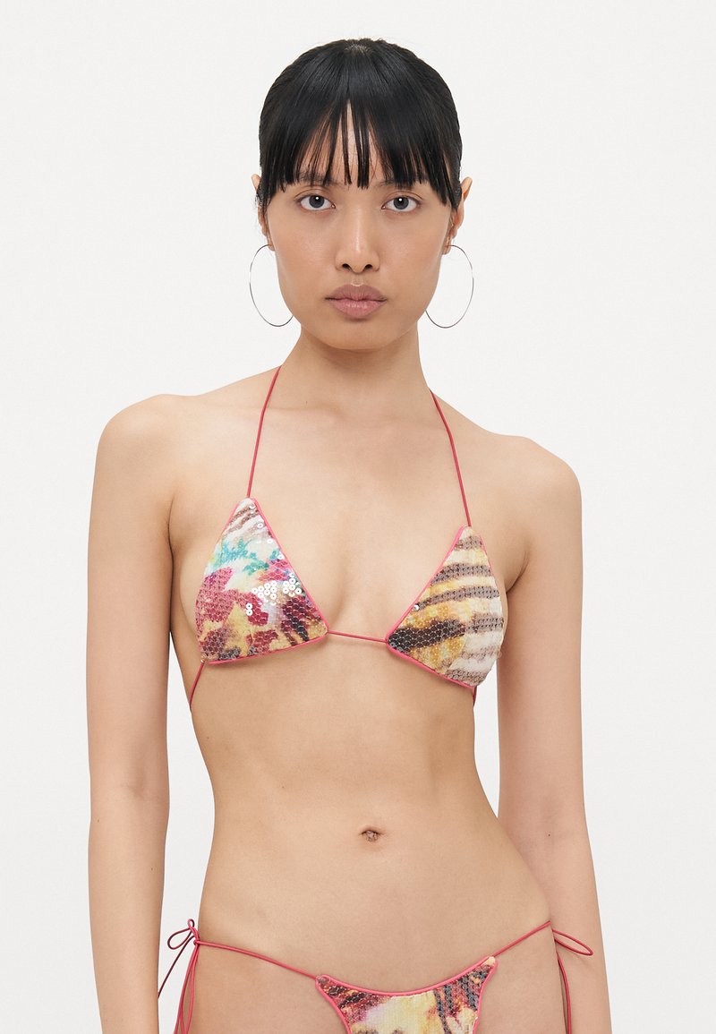 Bikini set featuring triangular sequined cups in vibrant colors, red string ties, and a textured fabric with abstract patterns.