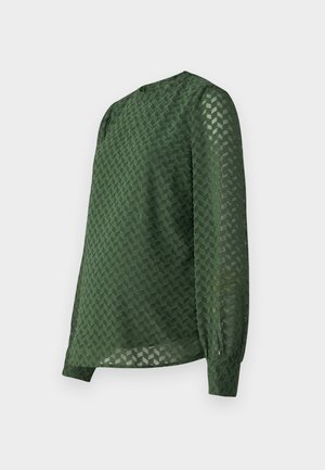 Green blouse featuring a textured chevron pattern, long sleeves, a round neckline, and a slightly loose fit with gathered cuffs.