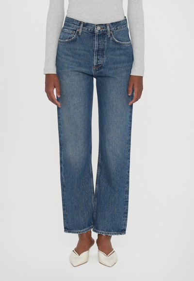Hoge taille, wijde pijpen jeans in mediumblauwe denim, met vijf zakken, subtiele slijtage en een rauwe zoom met stikdetails.
