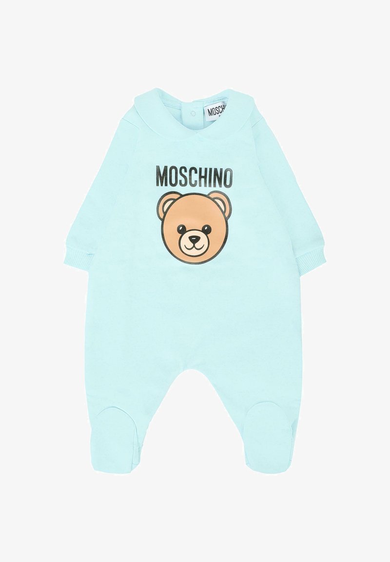 Jasnoniebieski kombinezon z długimi rękawami, z grafiką brązowego niedźwiedzia oraz napisem "MOSCHINO". Miękka tkanina i zaokrąglony krój kołnierzyka.