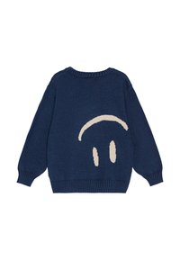 Mörkblå stickad tröja med långa ärmar, ribbade muddar och ett stort beige smiley-ansikte designat på baksidan. Mjuk yta.