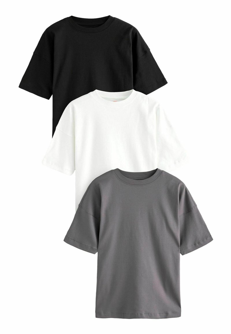 Set van drie kortebloes T-shirts in zwart, wit en grijs. Gemaakt van katoen, met een ronde halslijn en een ontspannen pasvorm.