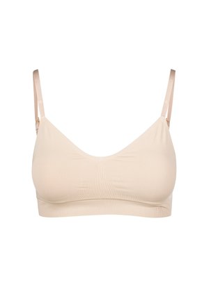Beige kabelloser BH aus glattem Stoff, minimalistisches Design, verstellbare Träger und subtile Stichdetails. Weiche, nahtlose Verarbeitung.