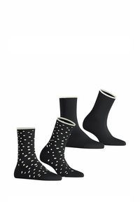 Drei Paar Socken: zwei einfarbige schwarze mit weißen Akzenten, ein gemustertes schwarzes mit weißen Punkten. Weiches Material, unterschiedliche Höhen und Stile.