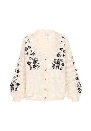Creme cardigan med V-hals, oversized ærmer og blomster-lignende pailletter i sort, sølv og grå. Fem knapper foran.