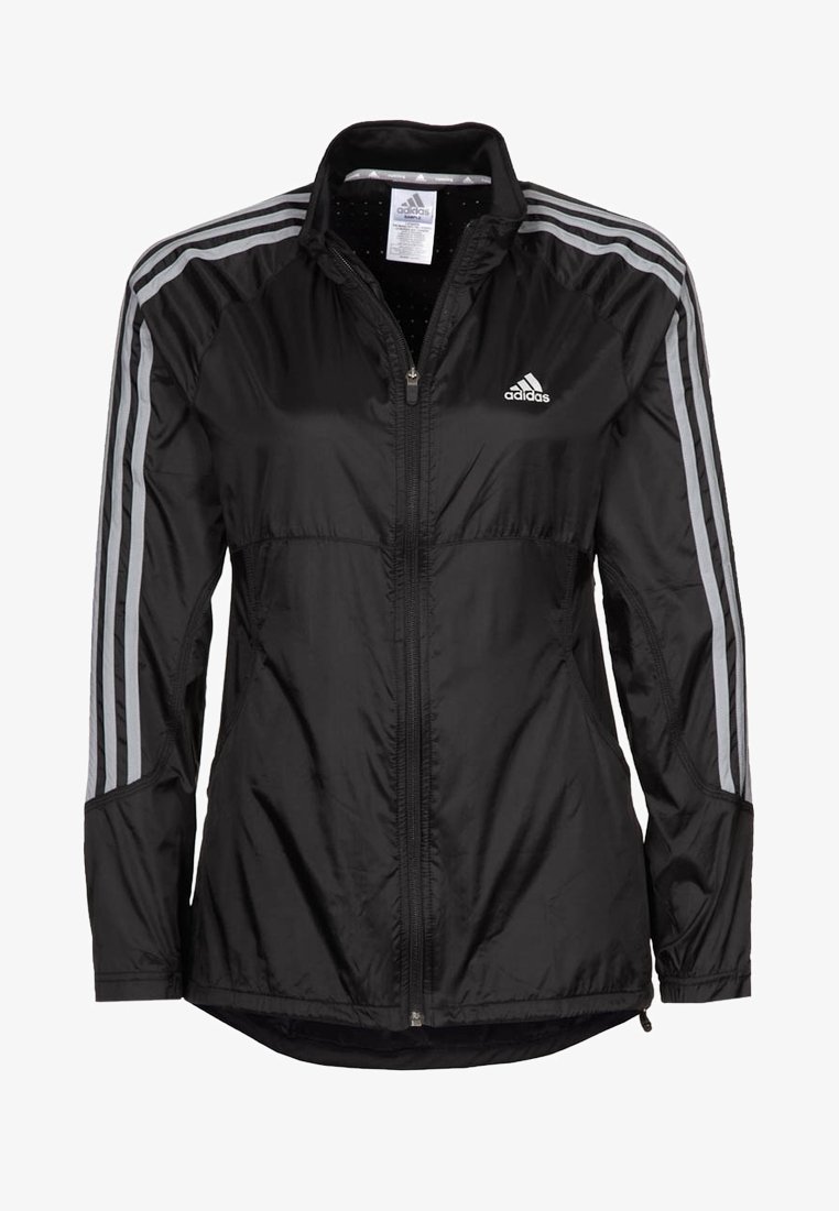 Veste de sport noire Adidas avec fermeture éclair complète à l'avant, trois bandes blanches sur les manches et logo Adidas sur la poitrine.