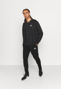 adidas Performance Calças de fato de treino - black