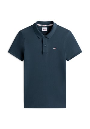 Marineblauw poloshirt met korte mouwen, twee knopen, kraag en klein Tommy Jeans-logo op de linkerborst.