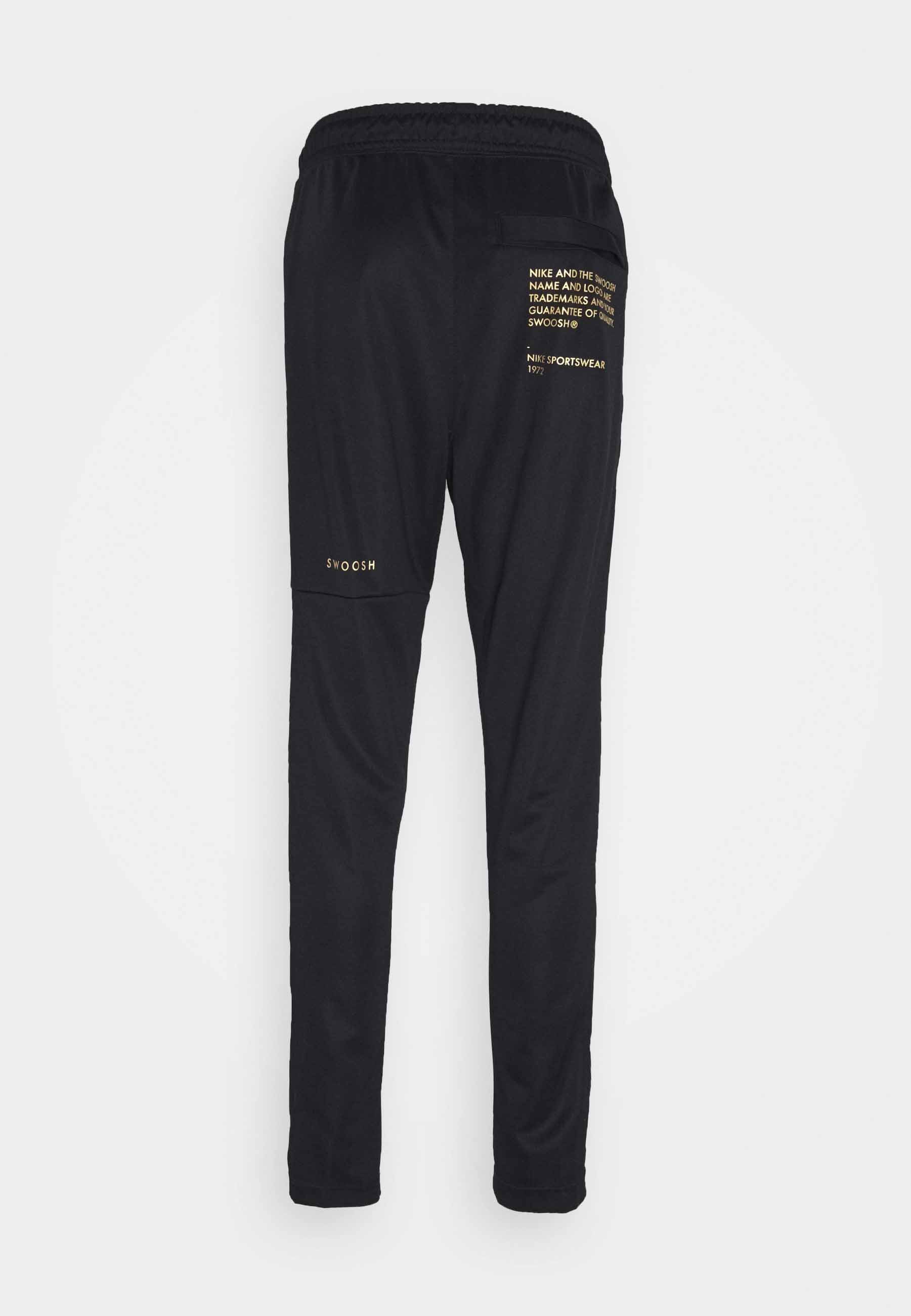 nike black gold tracksuit