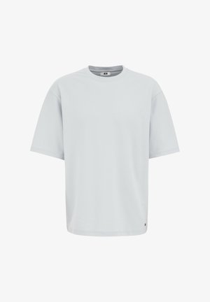 Helles graues oversized T-Shirt, Baumwollmischung, Rundhalsausschnitt, kurze Ärmel, glatte Textur, mit einem kleinen Logoakzent unten links.