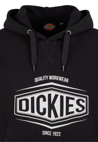 Black hoodie featuring drawstrings, a front kangaroo pocket, and a white graphic logo that reads "DICKIES" prominently on the chest.