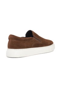 Brown suede slip-on sneaker with a white rubber sole, featuring a rounded toe and elastic side panels for easy wear.