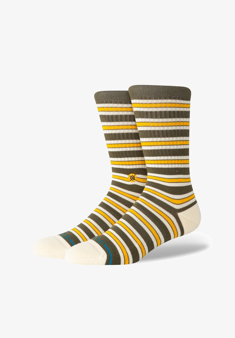 Striped socks in olive green, white, and yellow; ribbed cuff; cream toe and heel accents; features a small logo detail on the side.