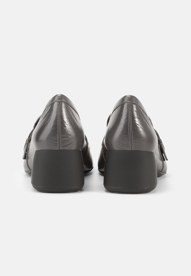 Grey leather shoes with a textured finish, featuring a low black heel and a decorative buckle on the side. Side profile view.