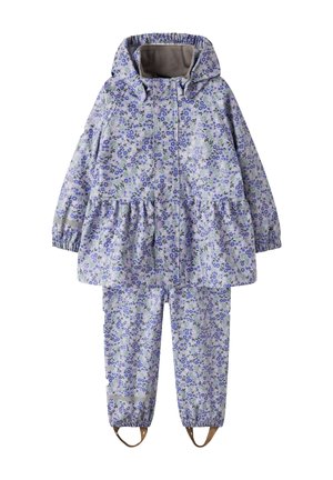 Combinaison de pluie enfant deux pièces avec capuche, poignets élastiques et étriers, avec un motif floral violet et vert sur fond clair.