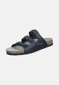 Black slip-on sandal with three adjustable buckled straps, cork footbed, gray suede insole, and textured black sole.