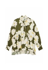 Blusa floreale verde caratterizzata da grandi fiori bianchi con centri gialli, scollatura a fiocco e maniche lunghe con polsi arricciati. Tessuto dalla consistenza più morbida.
