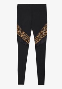 Leggings neri con pannelli a stampa leopardata in un design a zig-zag. Presentano un tessuto testurizzato, fantasie contrastanti e una cintura elasticizzata.