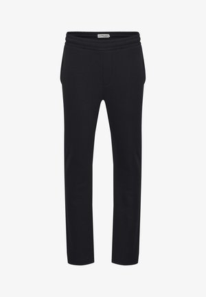 Mustat trenni püksid kitseneva disainiga, laia elastse vöökoha ja küljetaskutega. Valmistatud pehmest, tekstuuriga kangast.
