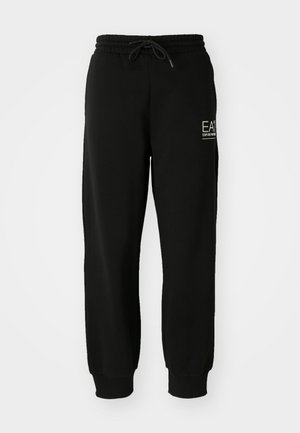 Zwarte joggers gemaakt van een zachte katoenmix, met een elastische tailleband, trekkoord en taps toelopende enkels. Inclusief logo detail aan de voorkant.