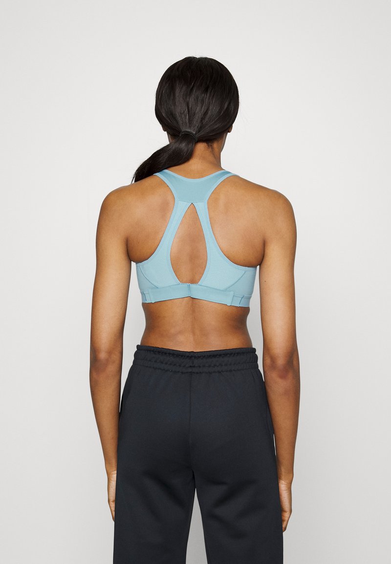 Damen Sportbekleidung | Nike Performance BRA Sport-BH mit leichter Stützkraft worn blue/black/blau - FY02756 Damen Sportbekleidung | Nike Performance BRA Sport-BH mit leichter Stützkraft worn blue/black/blau - FY02756