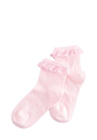 Calzini rosa alla caviglia con bordo a volant in pizzo, realizzati in tessuto morbido con una texture liscia. Leggeri e progettati per garantire comfort.