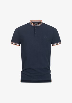 Tengerészeti póló gallérral, két gombbal és narancs és fehér csíkozással az ujjakon. Kis logó található a mellen.