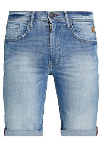 Ljusblå denimshorts med en klassisk design, med uppvikta fållar, dragkedja och flera fickor. Slitna detaljer vid fickorna.