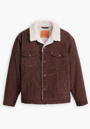 Chaqueta de pana marrón con un cuello de borreguito blanco. Cuenta con cierre de botones y dos bolsillos en el pecho. Etiqueta visible en el interior del cuello.