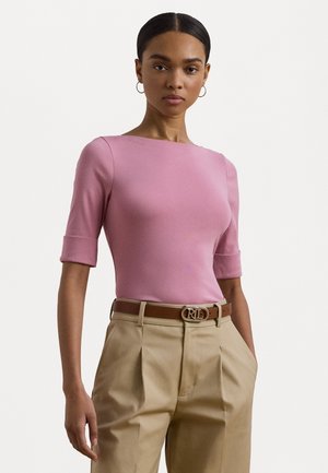 Pink fitted top with short sleeves, crew neckline, and smooth texture. Paired with beige high-waisted trousers and a brown belt with logo buckle.