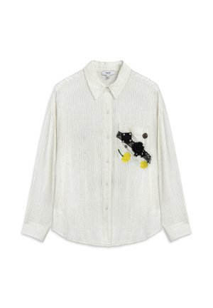 Witte textuur blouse met kraag, lange mouwen en een patch pocket versierd met zwarte en gele bloemenapplicaties en kanten accenten.