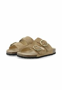 Wildleder-Slide-Sandalen in hellem Beige mit zwei breiten Riemen, Akzenten aus goldfarbenem Metall und einer strukturierten Korksohle. Gummisohle für besseren Halt.