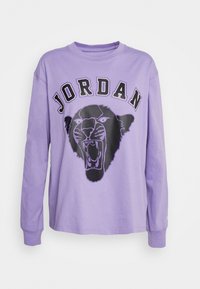 Pitkähihainen violetti collegepaita, jossa on musta leijonagrafiikka ja "JORDAN"-teksti. Pehmeä kangas, pyöreä kaula-aukko ja ribbireunukset.