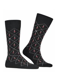 Calzini neri con un motivo a diamante e grafiche di soldatini rossi e grigi, realizzati in un tessuto morbido con una texture liscia.