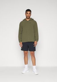 Under Armour VANISH SHORTS - Sportiniai šortai - black/morph green