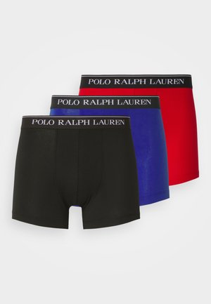 Tres pares de calzoncillos tipo boxer para hombre en negro, azul y rojo. Cada uno cuenta con una suave cinturilla con el logotipo "POLO RALPH LAUREN". Tejido suave y elástico.
