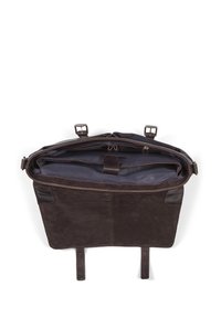 Brown leather tote bag with a sturdy design. Features a navy interior, dual clip closures, and a single zip pocket inside.