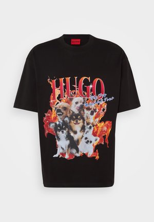 Black t-shirt featuring a vibrant graphic of multiple dogs against a fiery background. "HUGO" prominently displayed in bold red text.
