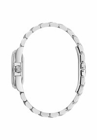 Sudraba metāla pulkstenis ar apaļu korpusu, pulētu apdari un saites siksnu ar ovālas formas elementiem. Iekļauj logotipa detaļu sprādzē.