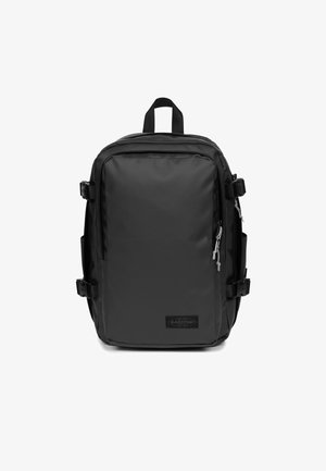 Sac à dos noir en tissu durable de forme rectangulaire, avec des compartiments zippés, des sangles latérales ajustables et une poignée supérieure.