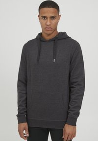 Dark gray hoodie made of soft cotton blend, featuring a front pocket, drawstring hood, and ribbed cuffs. Simple, classic design.