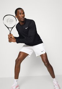 Nike Performance M NKCT DF ADVTG TOP HZ - Pikkade varrukatega topp - black/white