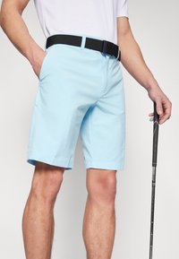Light blue shorts made of lightweight fabric, featuring a flat front, belt loops, and pockets. The waistband is complemented by a black belt.
