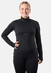 Maglietta atletica nera a maniche lunghe, realizzata in tessuto elasticizzato, con collo a mezza zip, design aderente e piccolo logo montano sul davanti.
