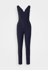 Mörkblå jumpsuit med en djup V-ringning, figurnära midja och smalnande byxben. Tillverkad av ett mjukt tyg med plisserad frontdetalj.