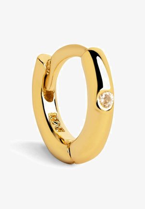 Goldene Creolen mit glatter, glänzender Oberfläche. Mit einem kleinen klaren Kristallakzent und einer nahtlosen, runden Form.